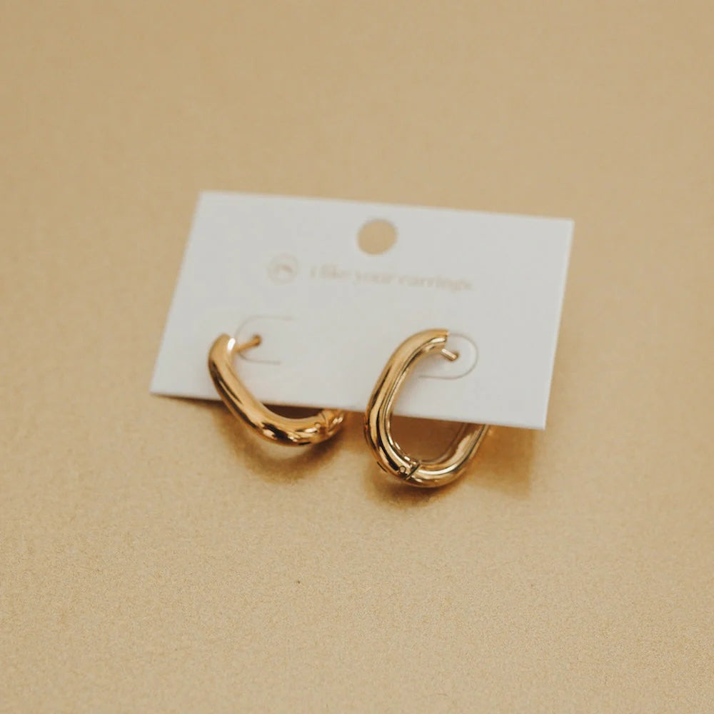 Hoop earrings with polished metal for a shiny and high-quality finish-Flirty Fantasy Oval Hoop Earrings by Pretty Simple